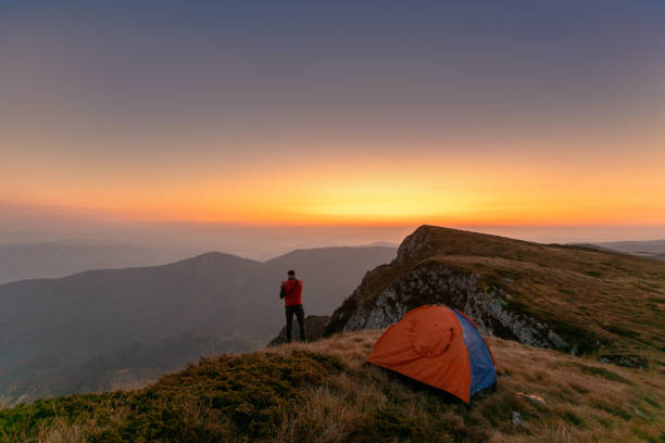 istock Photographer camping 1182319868
