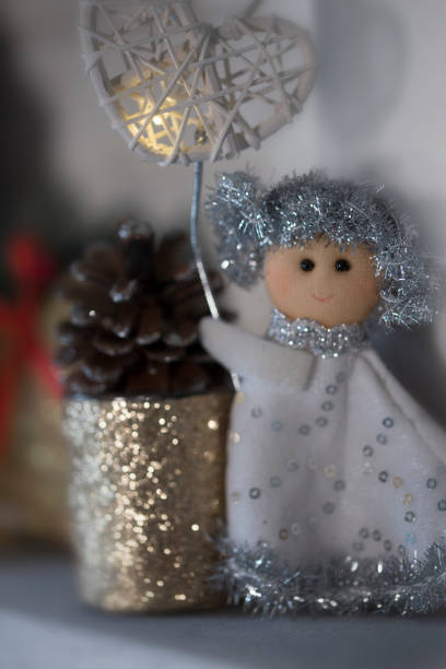 istock Christmas Angel with a bright heart 1182320580