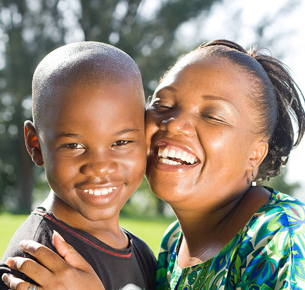 African Mother with Baby Son at Home\nMalawi, Africa