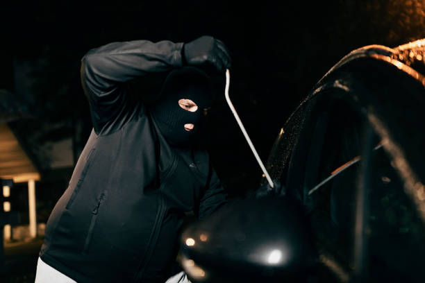 istock Car Burglar in the Action 1182323165
