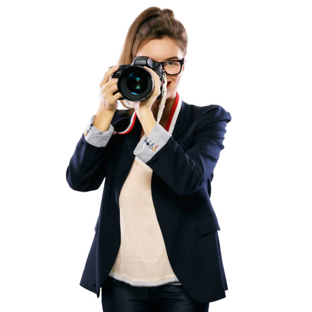 istock Woman photographer with a DSLR camera 1182326185