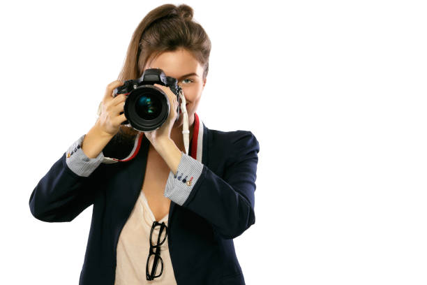 istock Woman photographer with a DSLR camera 1182326321