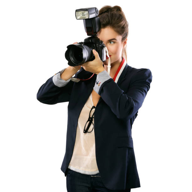 istock Woman photographer with a DSLR camera 1182326451