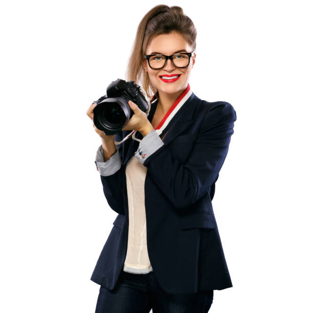 istock Woman photographer with a DSLR camera 1182326636