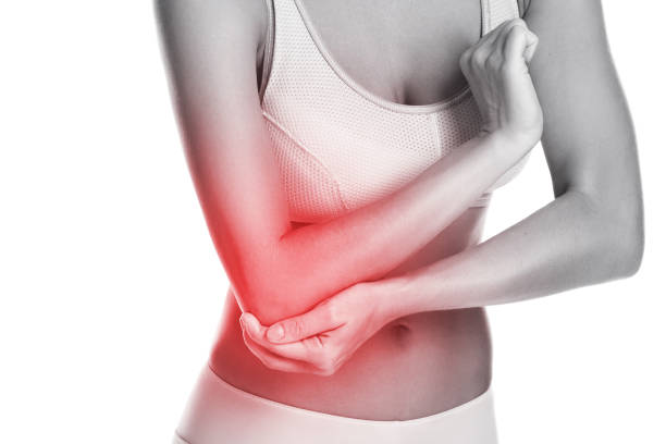 istock Woman with pain in her elbow 1182328319