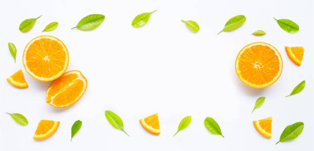 istock Frame made of fresh orange fruit with green leaves on white 1182328859