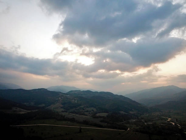 istock Aerial view of mountains with cloudscape 1182329788