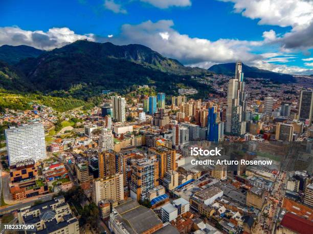 Bogota Cityscape Of Big Buildings And Mountains And Blue Sky Stock Photo - Download Image Now