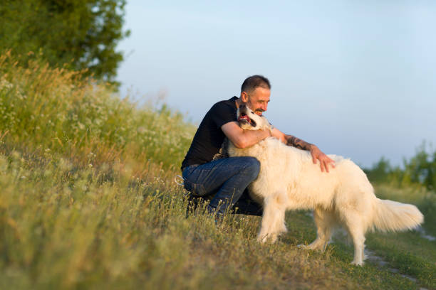 istock Man embracing his dog 1182341243