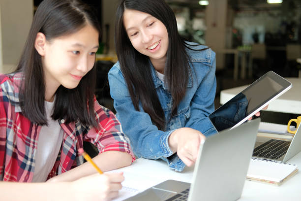 istock girl teenager studying with tablet computer. college high school student taking note 1182341359