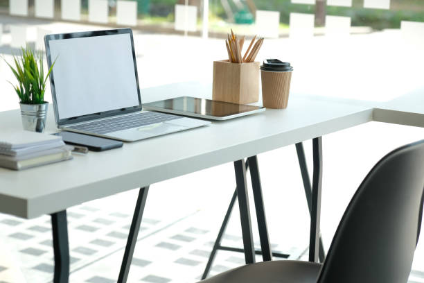 istock computer tablet pencil coffee cup on office desk. workplace interior 1182341381