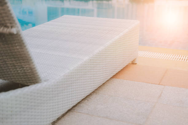 istock wicker rattan pool sun bed deckchair at swimming pool 1182341400