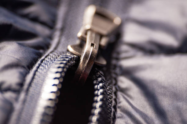 istock Zipper slider on. Buttoning and unfastening clothes. Close-up, selective focus. 1182341481