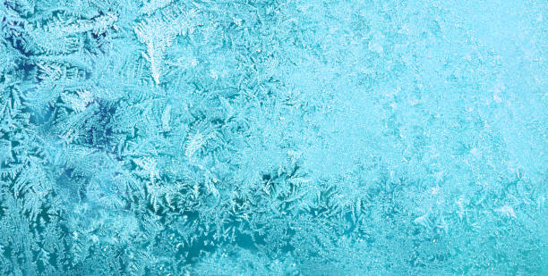 istock Frost on glass in window winter. pattern snow and ice 1182341649