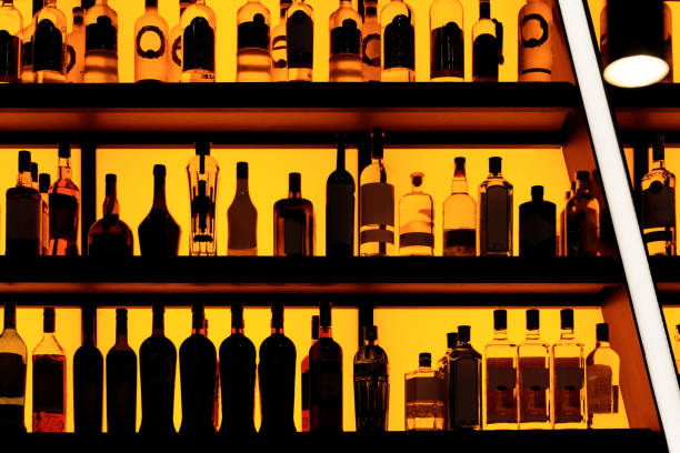 istock Bottles sitting on shelf in a bar 1182341905