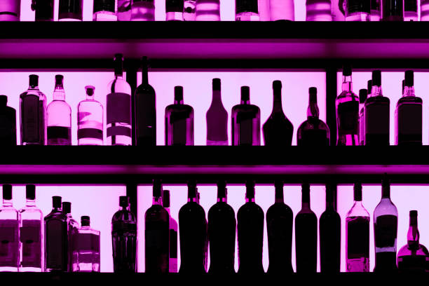 istock Rows of bottles sitting on shelf in a bar 1182341910