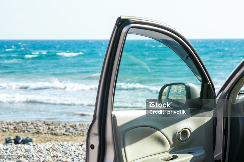 Car door and sea Car door and beautiful seascape Car Stock Photo