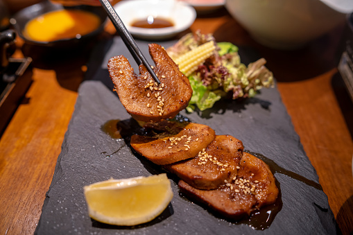 Grilled beef tongue slices in a Japanese restaurant.