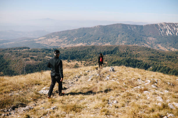 istock People hiking through the mountains 1182350139