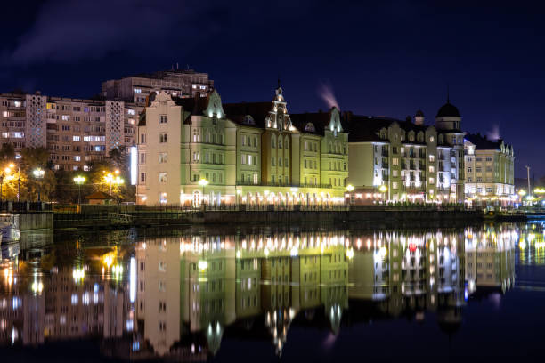 istock night cityscape near the river with bright lights 1182350248