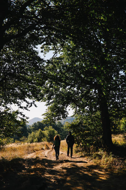 istock People hiking through the forest 1182351610