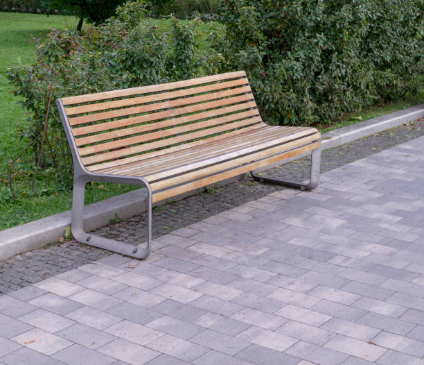 istock bench in the summer park. background, nature. 1182352122