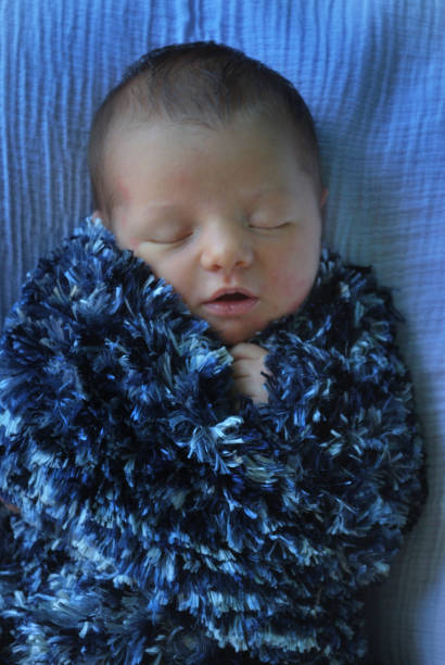 istock Wrapped Baby In Blue 1182354758