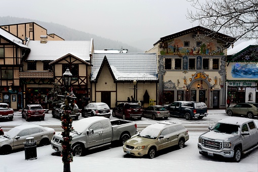 Leavenworth, Washington, USA - December 26th, 2018: Beautiful Christmas decorations and lights covered by snow in Leavenworth, the famous Bavarian village in Washington