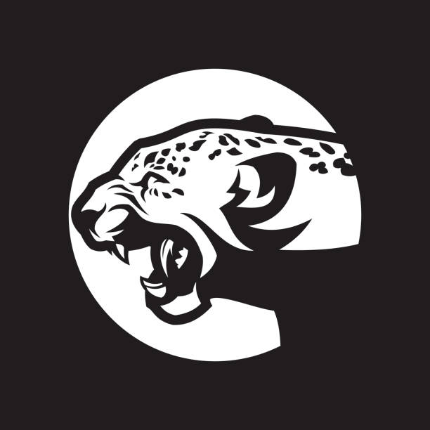 Leopard head silhouette. Wild cat with open mouth - cut out vector icon Angry leopard head silhouette. Attacking wild cat with open mouth - cut out vector icon angry cat silhouette stock illustrations