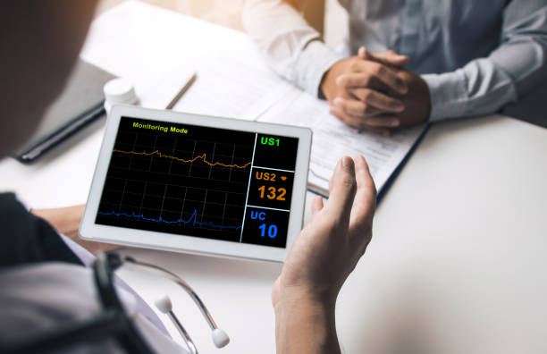 istock Asian doctor talking the patient at clinic while using the tablet explaining the patient condition and the treatment result. 1182361106