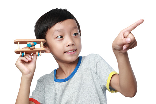 Boy hand holding a toy plane
