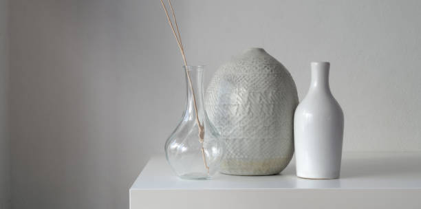 istock Minimal room with ceramic vases decoration on white table 1182361359