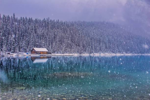 istock Snow Falling At Lake Louise 1182364099