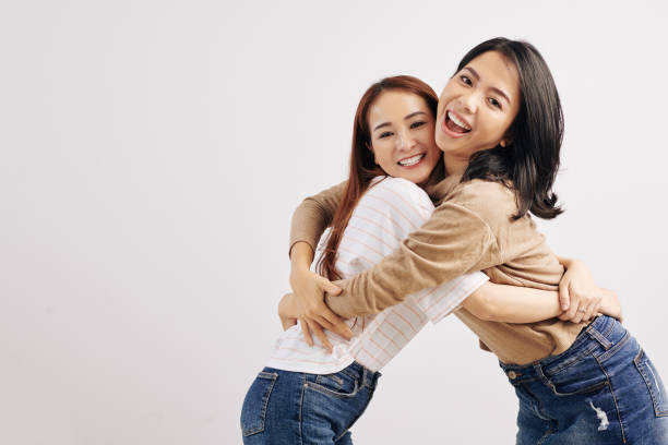 istock Happy hugging Vietnamese women 1182375790