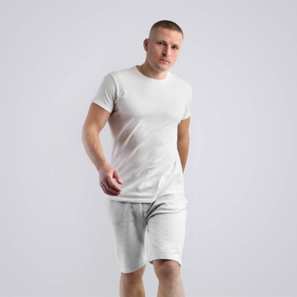 istock Attractive caucasian young man  in a blank T-shirt on a white studio background. 1182376067