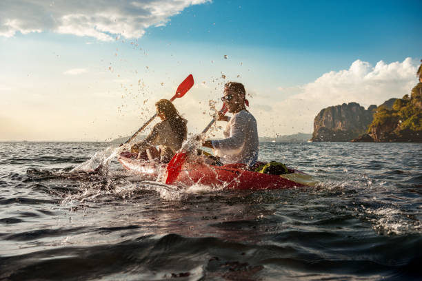 istock Happy couple having fun and walks on kayaks 1182376076