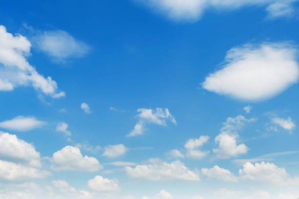 istock blue sky with white cloud and sunshine 1182381231