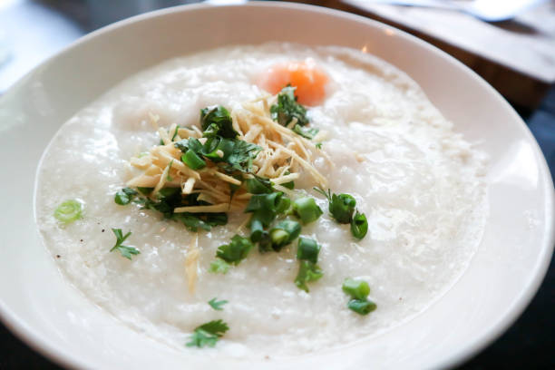 gruel or rice gruel or congee with egg and pork stock photo