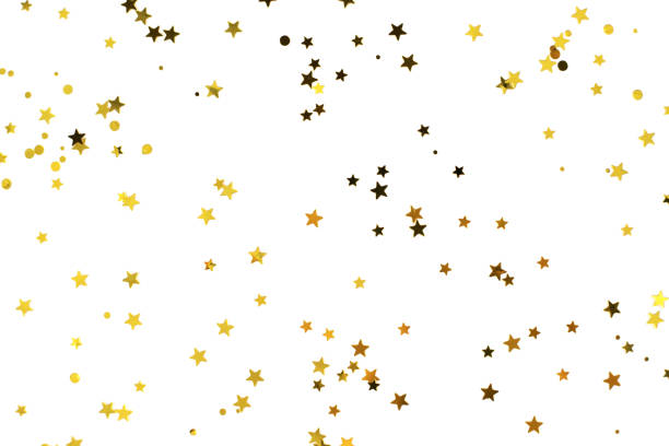 kilka złotych gwiazd na białym tle. - gold confetti star shape nobody zdjęcia i obrazy z banku zdjęć
