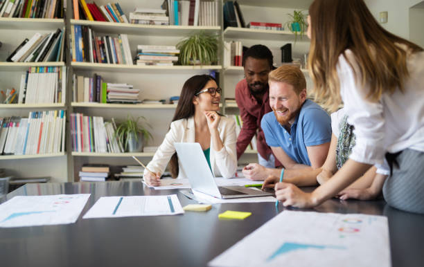 istock Group of successful business people at work in office 1182381548