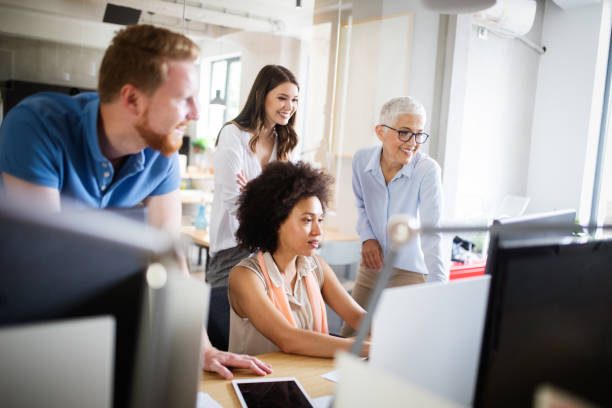 istock Group of business people collaborating on project in office 1182382198