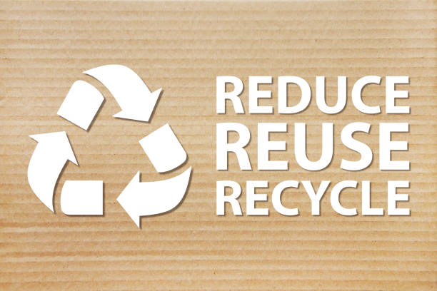 istock Refuse reuse recycle symbol with cardboard background 1182383570