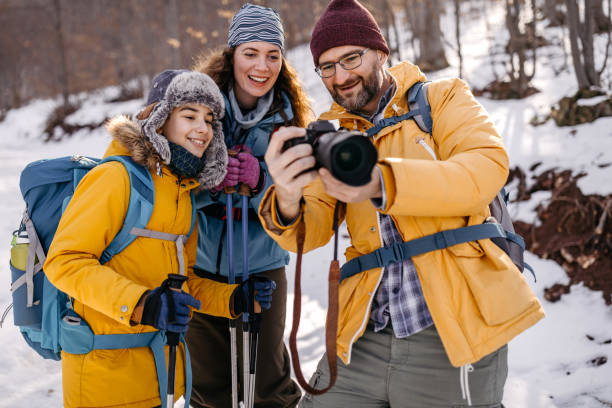 istock Family checking photos on dslr camera 1182389221