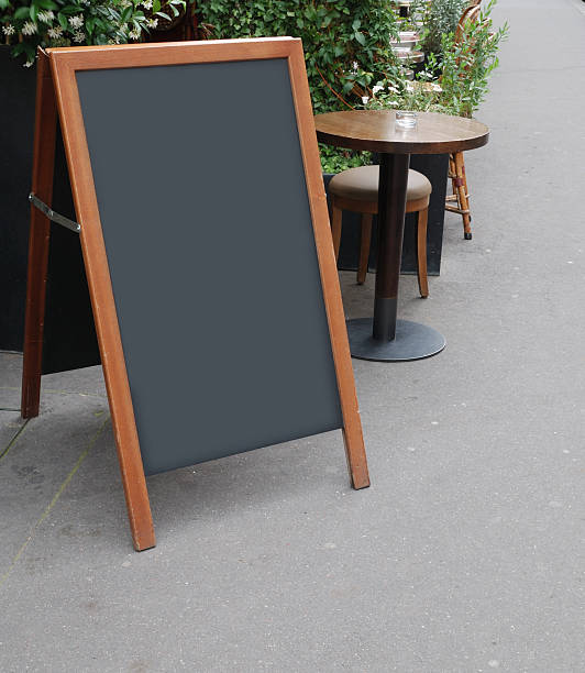 istock Parisian sidewalk with blackboard and tables 118238957
