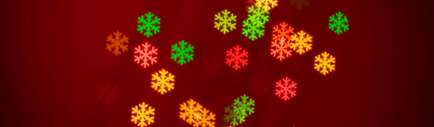 istock Christmas background - snowflakes shaped bokeh 1182390427