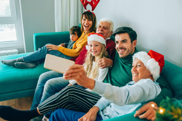 istock Family taking Christmas selfie. 1182391221