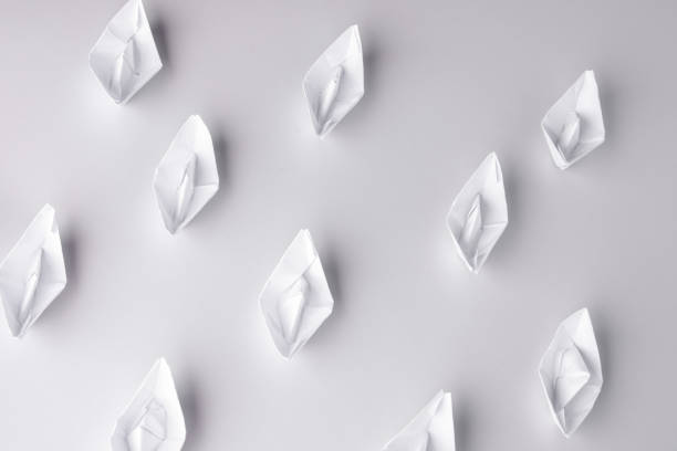 istock paper ships on a white background. White background 1182391341