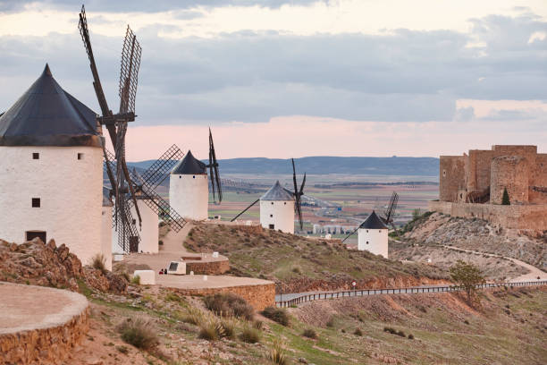 istock Traditional antique windmills at sunset in Spain. Consuegra, Toledo 1182391632