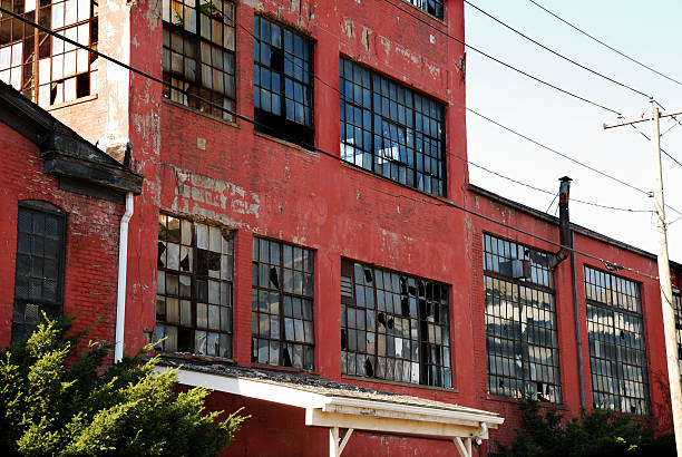 istock Abandoned red brick factory with broken windows 118239311