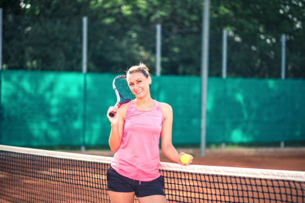 istock Woman playing tennis 1182399021